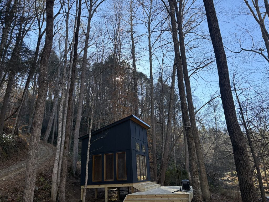 Finished modern cabin studio nestled in a wooded Greenville SC backyard