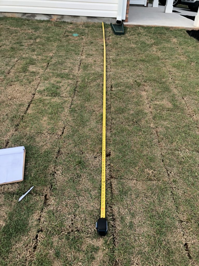 Professional site measurement and planning for shed foundation in Greenville SC