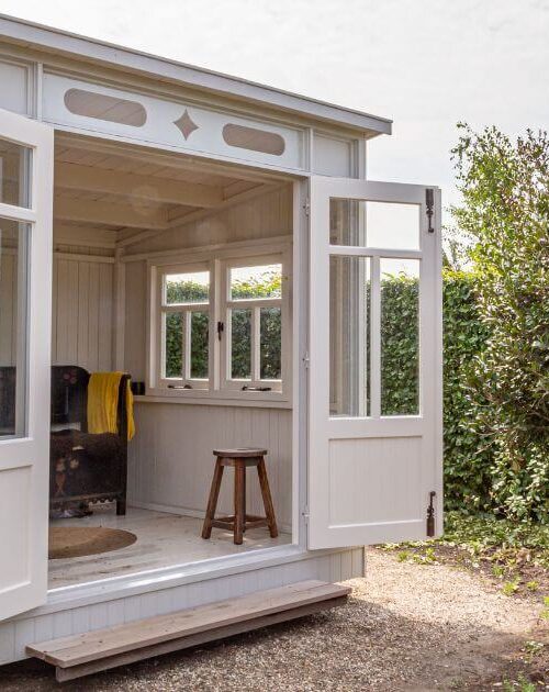 white-modern-she-shed-in-backyard-with-minimalist-design-1